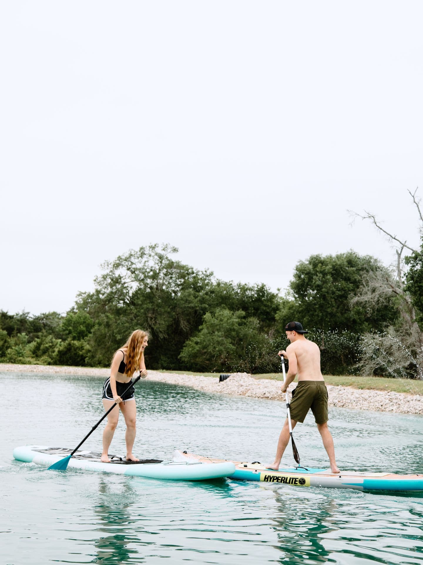A couple paddleboarding together on the spring-fed lake